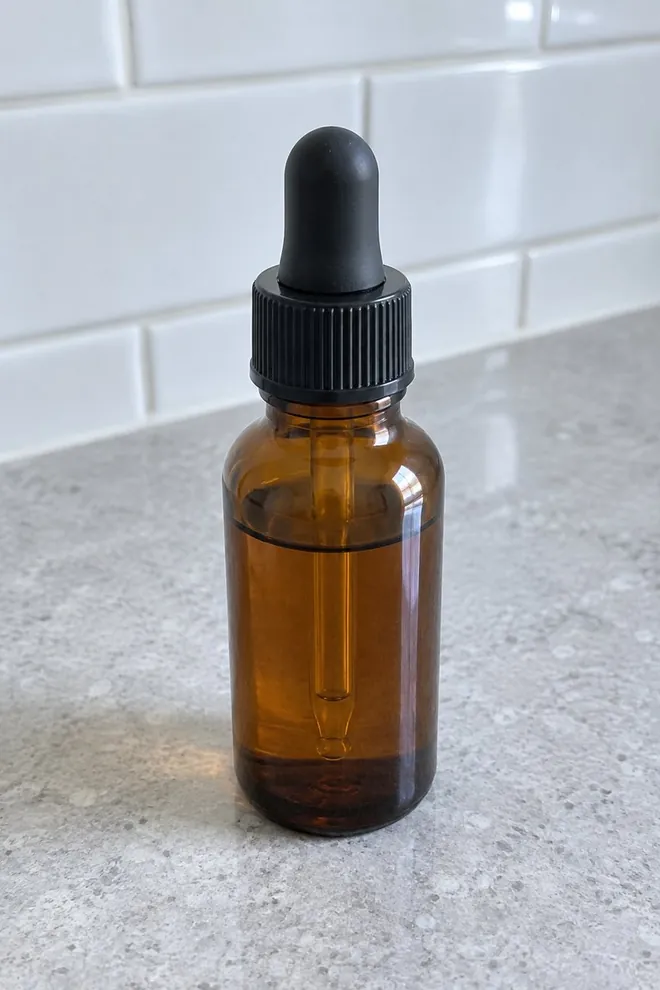A phone-style photo of the bottle on a stone bathroom counter
